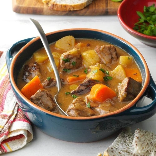 Earthenware dish of meat and vegetable stew